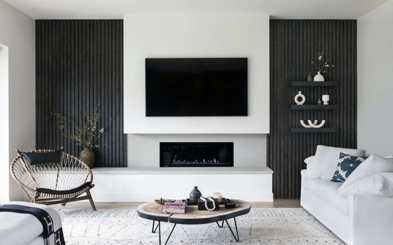 Phòng khách màu trắng sứ với nội thất gam màu đen sang trọng Phòng khách màu trắng sứ với nội thất gam màu đen sang trọng