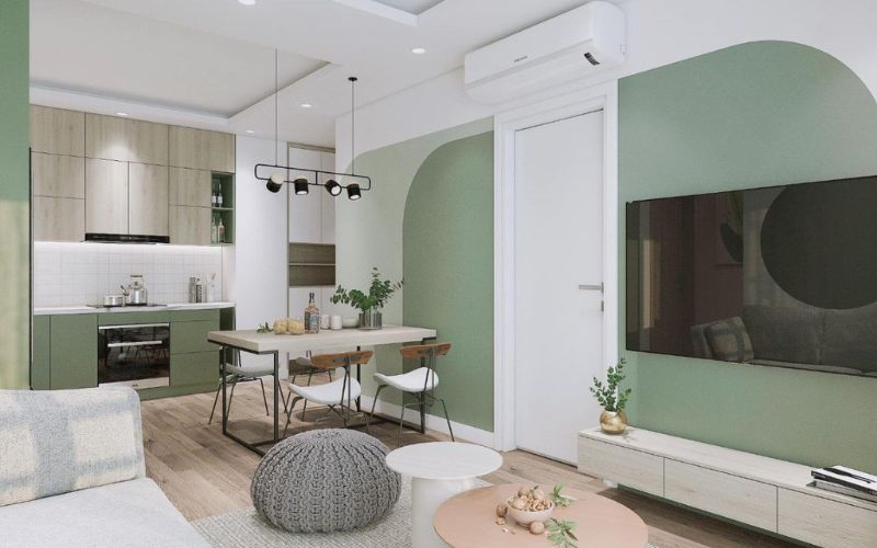 Sơn màu xanh lá phòng khách liền bếp khiến không gian mát mẻ hơn