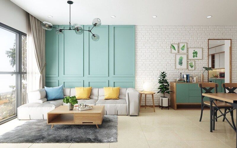 Sơn tường màu xanh ngọc phối trắng mang lại không gian phòng khách hiện đại, mới lạ